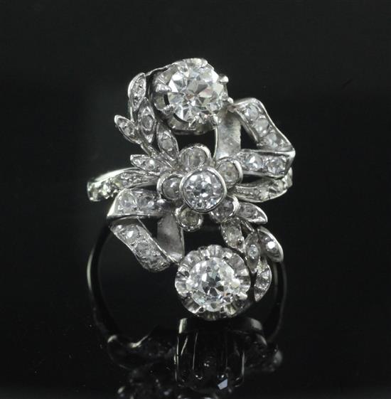 An 18ct white gold and diamond cluster upfinger ring, size M.